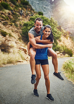 Buy stock photo Fitness, piggyback and portrait of couple in nature for marathon training, cardio workout or physical challenge. Runner, sports and woman carrying man on mountain for exercise, wellness or endurance