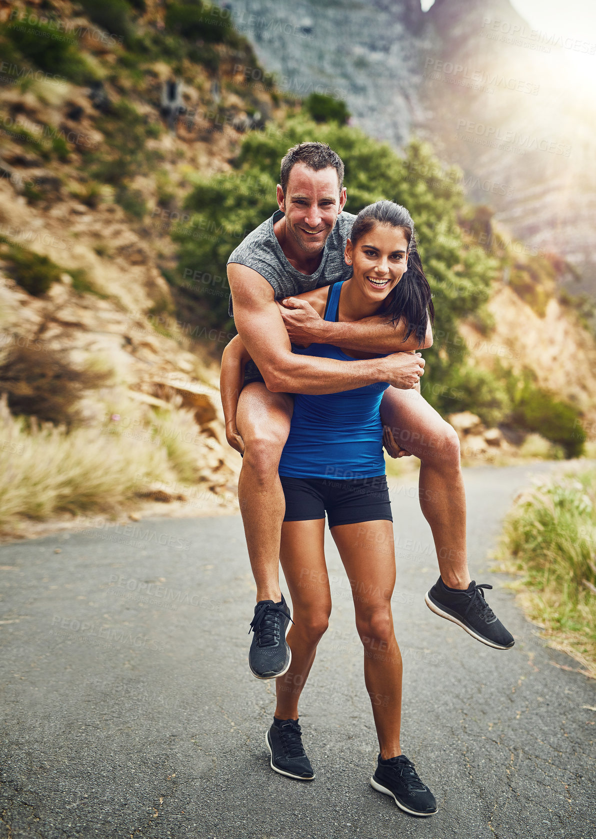 Buy stock photo Fitness, piggyback and portrait of couple in nature for marathon training, cardio workout or physical challenge. Runner, sports and woman carrying man on mountain for exercise, wellness or endurance