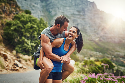 Buy stock photo Piggyback, fitness and happy couple with smile in nature for marathon training, cardio workout or challenge. Sunshine, sports and woman carrying man on mountain for exercise, wellness or endurance