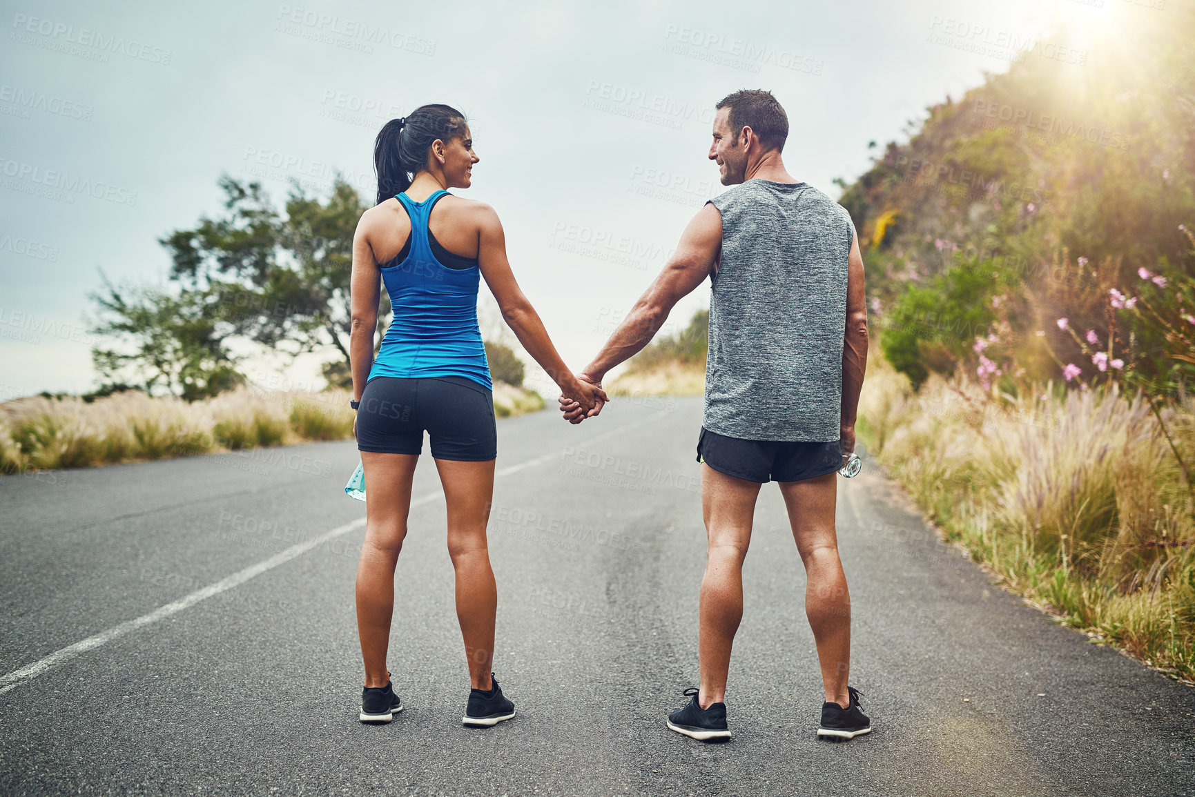 Buy stock photo Fitness, back and couple on street for exercise with holding hands, nature adventure and training for sports competition. Palm together, man and woman with run workout for marathon and strong body