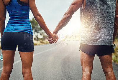 Buy stock photo Couple, holding hands and back for fitness on trail, support and exercise together in nature. Man, woman and running on road for love, athlete team and encouragement for marathon or run outdoors