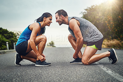 Buy stock photo Fitness, runner couple and tie shoes in road for cardio, workout, endurance training or marathon. Wellness, sneakers and athlete man with woman getting ready for running, sports or morning exercise