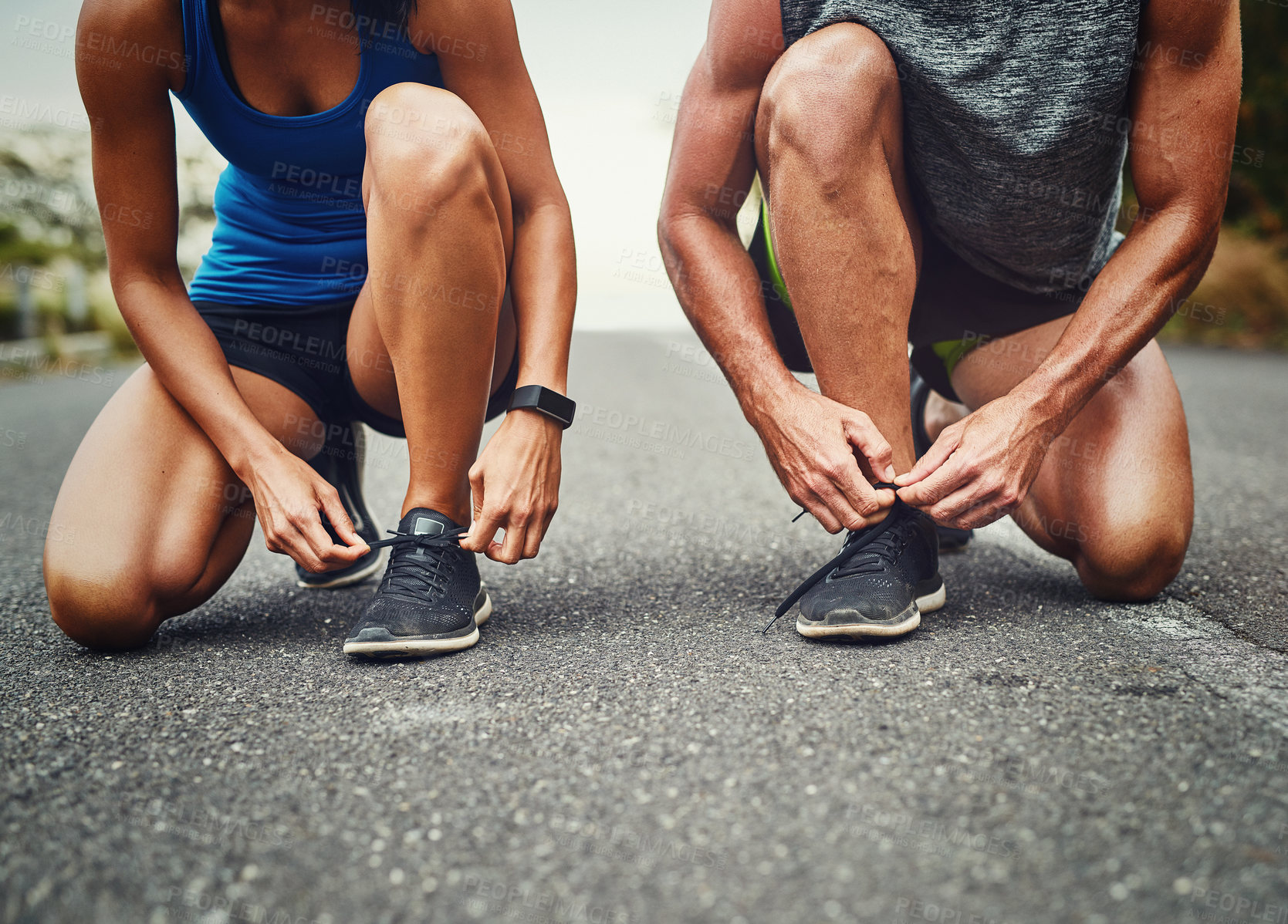 Buy stock photo Shot of an unrecognizable couple training for a marathon outdoors