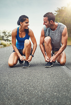 Buy stock photo Fitness, health and woman tying laces with coach on street for running training or marathon preparation. Sports, personal trainer and female athlete with warm up for cardio workout and exercise