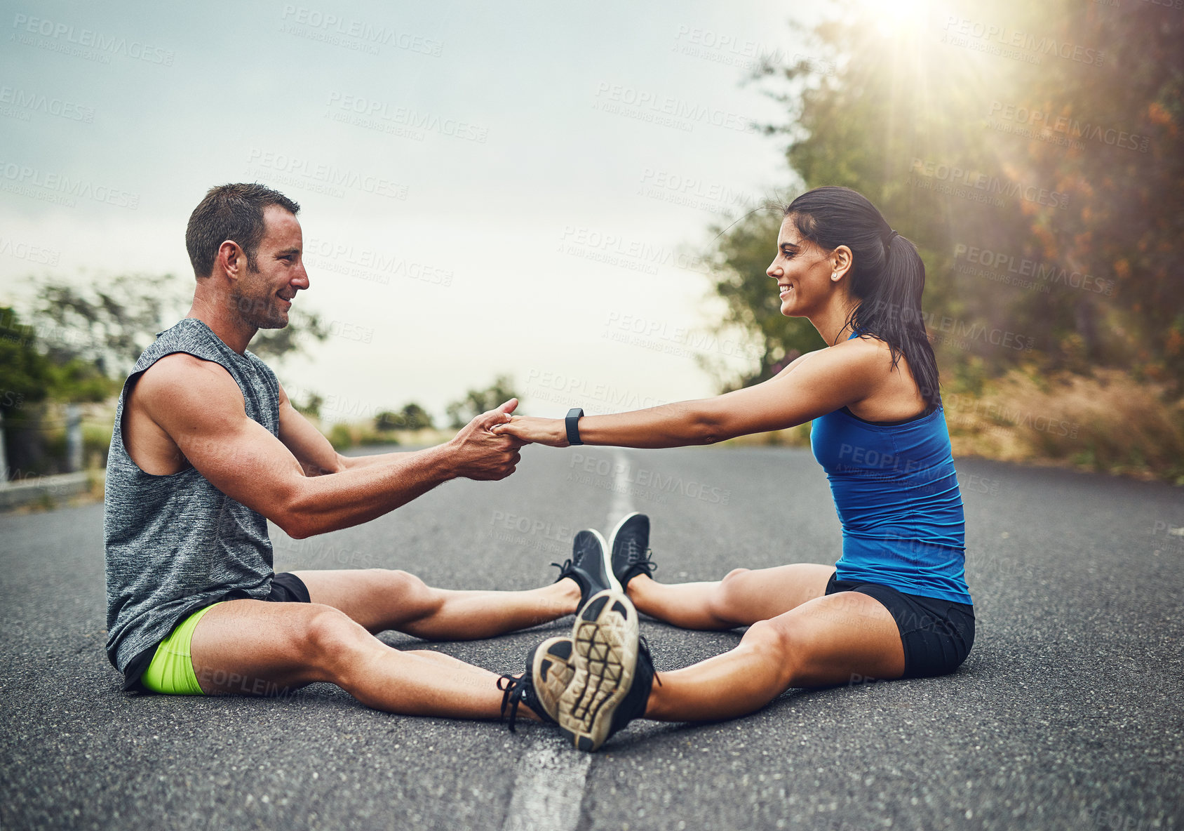 Buy stock photo Stretching legs, floor and couple in road with fitness for running challenge, marathon training or cardio in morning. Runner, warm up and athlete man with woman for workout, exercise or getting ready