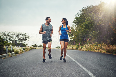 Buy stock photo Couple, road and smile with running for fitness for training, support and love in California. Workout, exercise and people with jogging for health or wellness and wellbeing in morning with lens flare