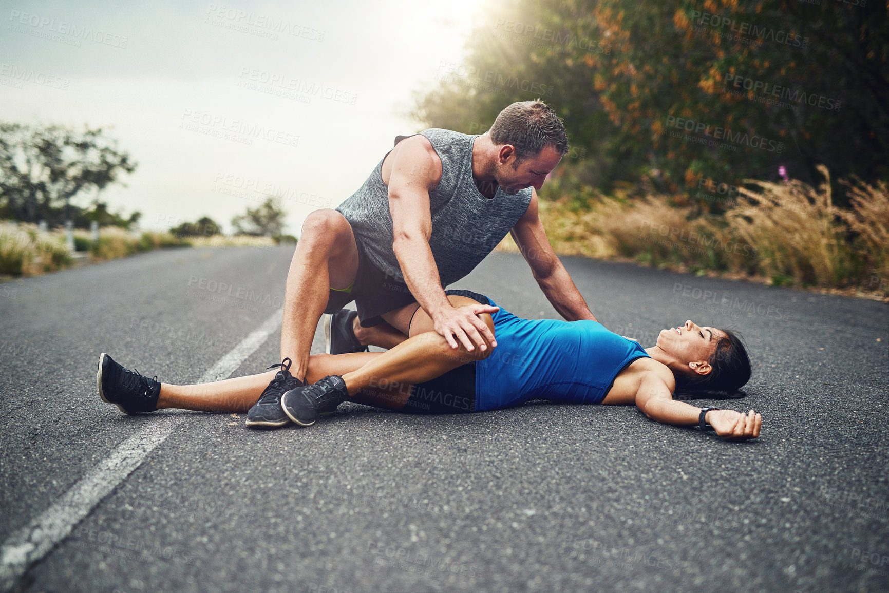 Buy stock photo Floor, stretching leg and couple in road with fitness for running challenge, marathon training or cardio in morning. Runner, warm up and athlete man with woman for workout, exercise or getting ready