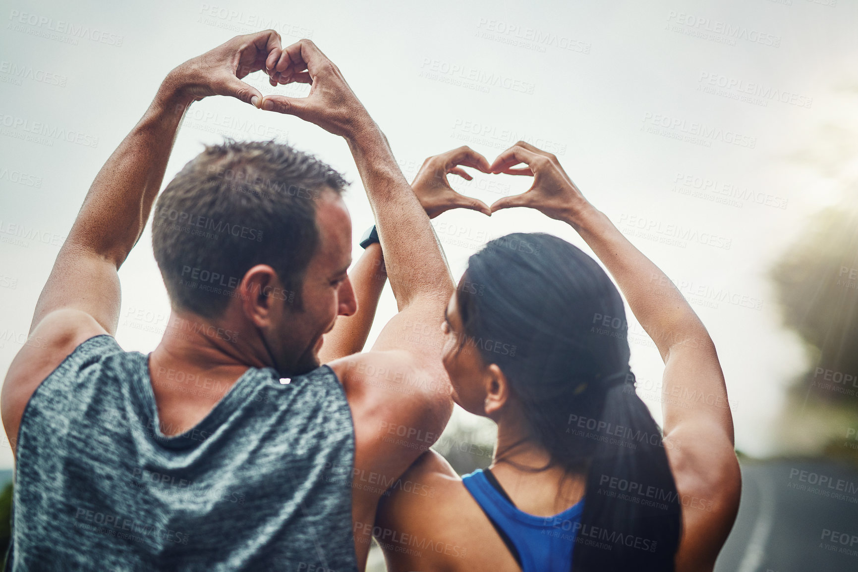 Buy stock photo Back, people and couple with heart sign for fitness, workout and exercise with health. Relationship, outdoor and happy on break with routine or activity for wellbeing, wellness and self care