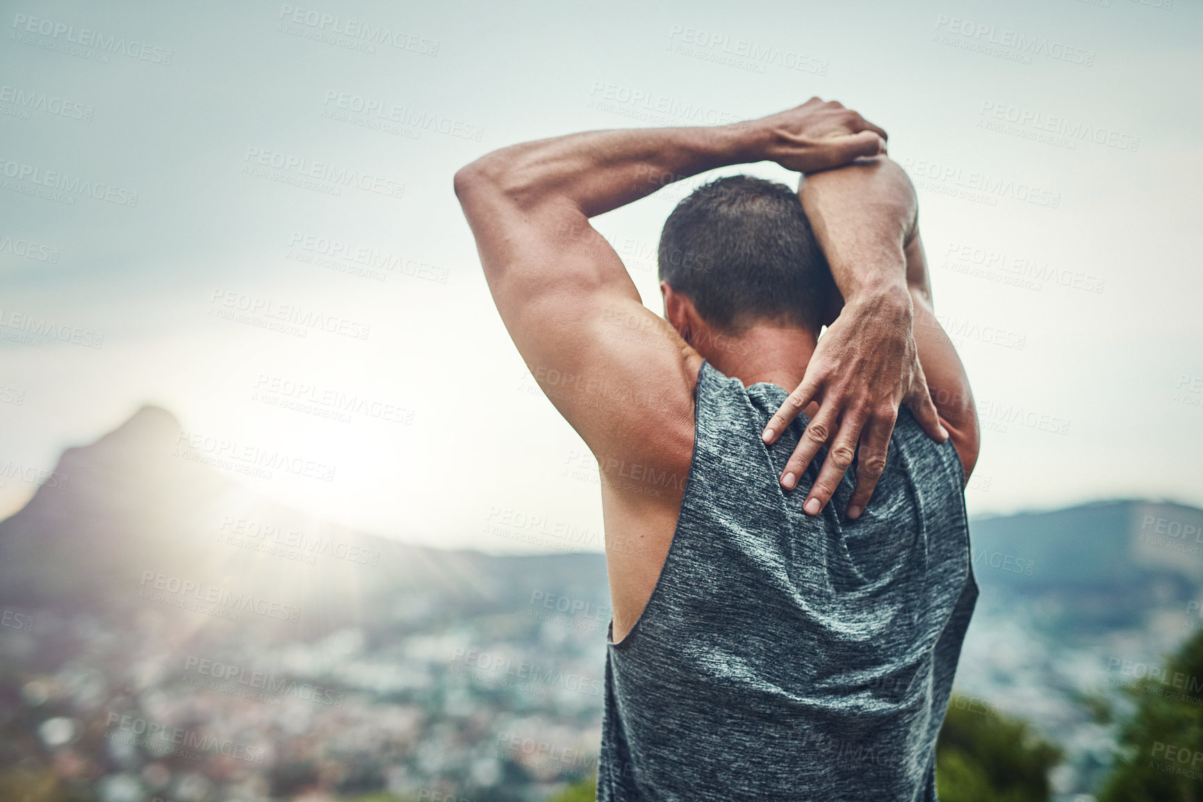 Buy stock photo Stretching, arms and back of man outdoor training on mountain in morning for benefits to fitness. Athlete, prepare and sunrise workout with resilience in summer challenge with progress in exercise