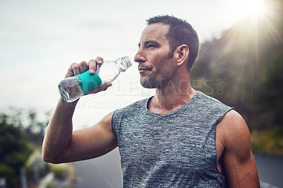 Buy stock photo Thinking, athlete and man drinking water on break to hydrate or relax for healthy energy in exercise. Tired, fatigue and thirsty male runner with liquid or fitness in marathon training or workout