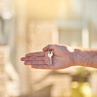 Buy stock photo Cropped shot of a man holding the key to his new home
