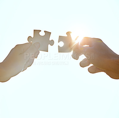 Buy stock photo A cropped shot of hands holding puzzle pieces