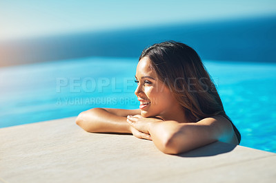Buy stock photo Cropped shot of an attractive young woman spending some time in the pool