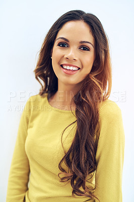 Buy stock photo Studio portrait of a gorgeous young woman posing against a light background