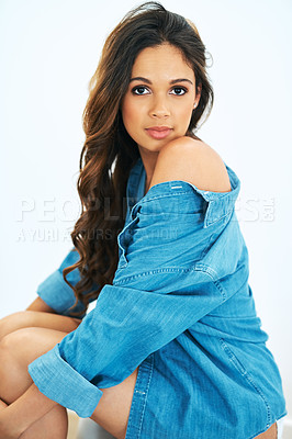 Buy stock photo Cropped shot of a beautiful young woman posing in a denim shirt
