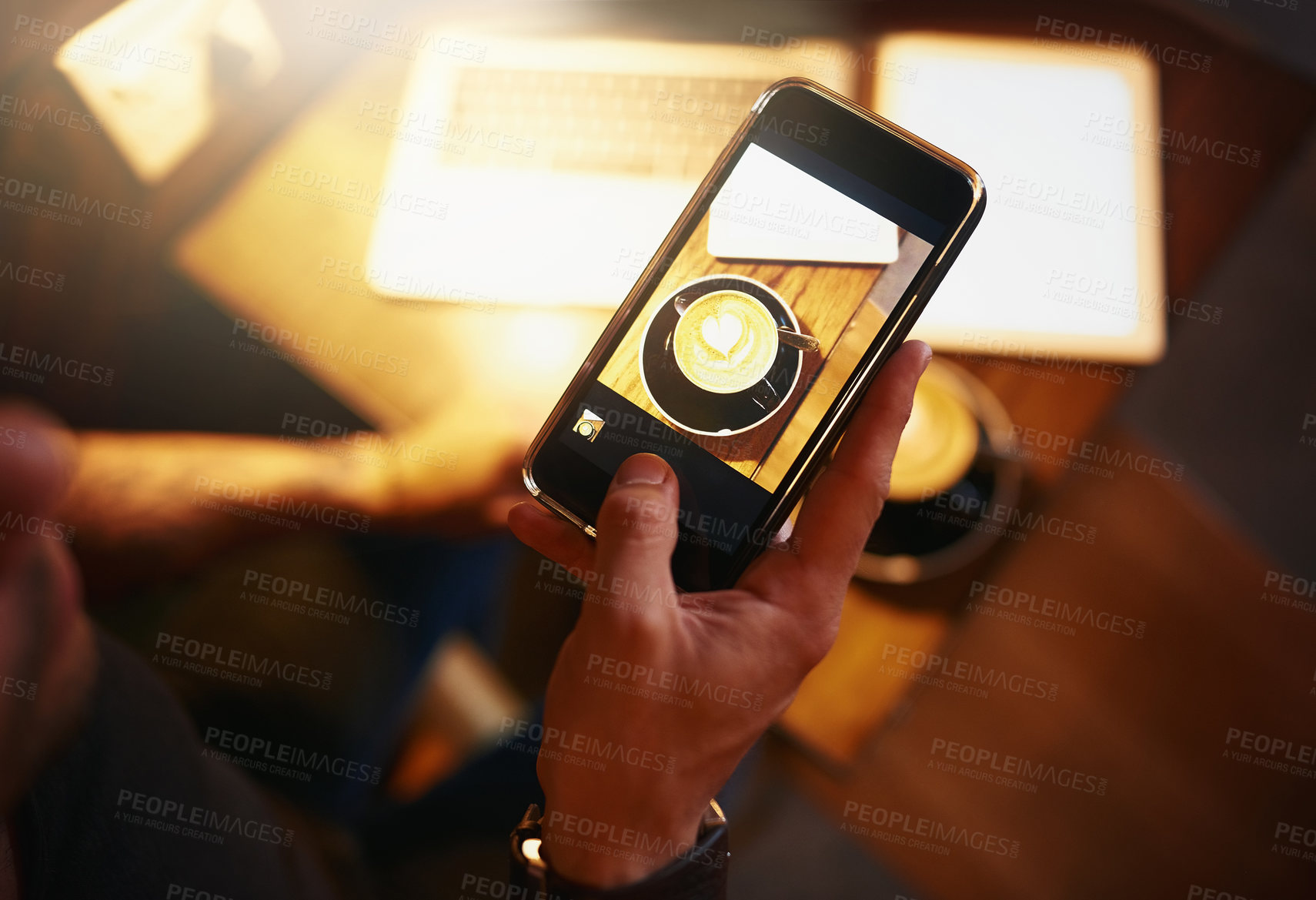 Buy stock photo Phone screen, hands and man at cafe with coffee photography for small business, social media or startup promotion top view. Smartphone, latte art and photographer with restaurant blog profile picture