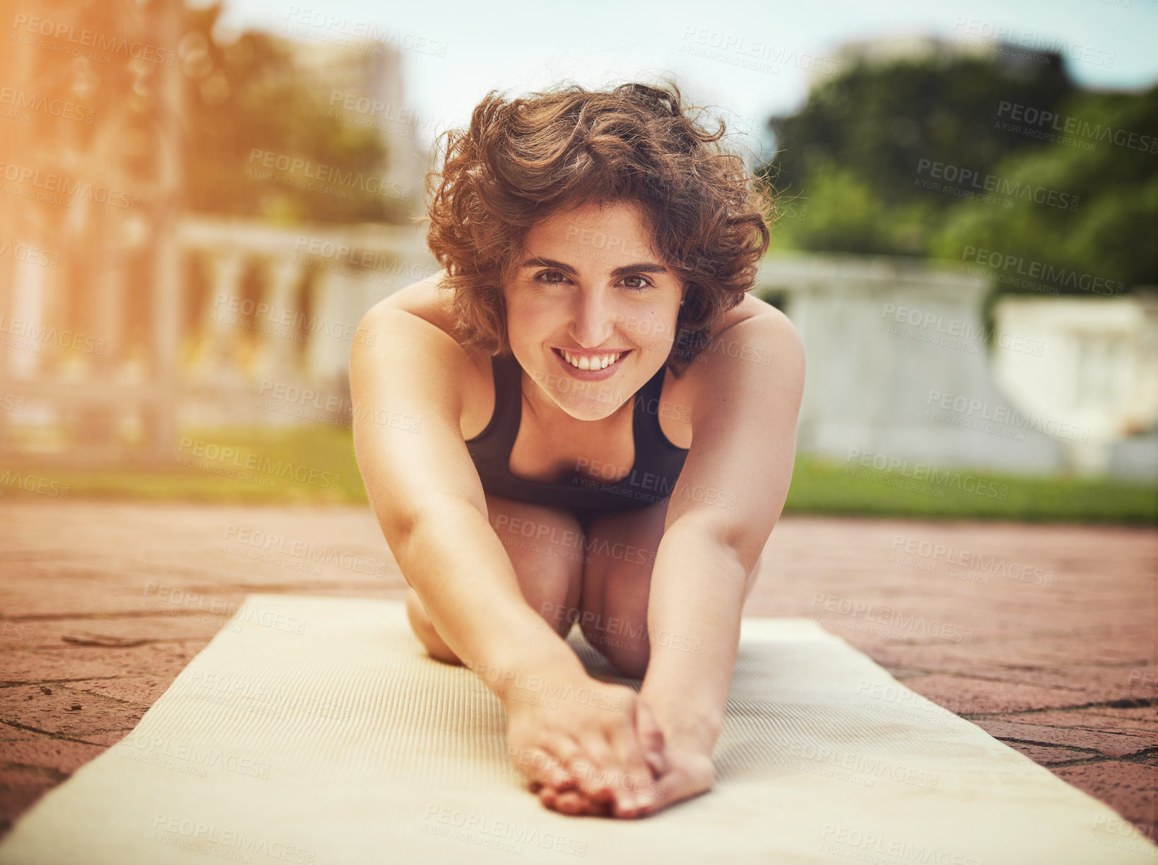 Buy stock photo Outdoor, yoga mat and portrait of woman stretching body for flexibility, balance or health workout. Smile, fitness and female person with pilates exercise in backyard for wellness at home in Canada.