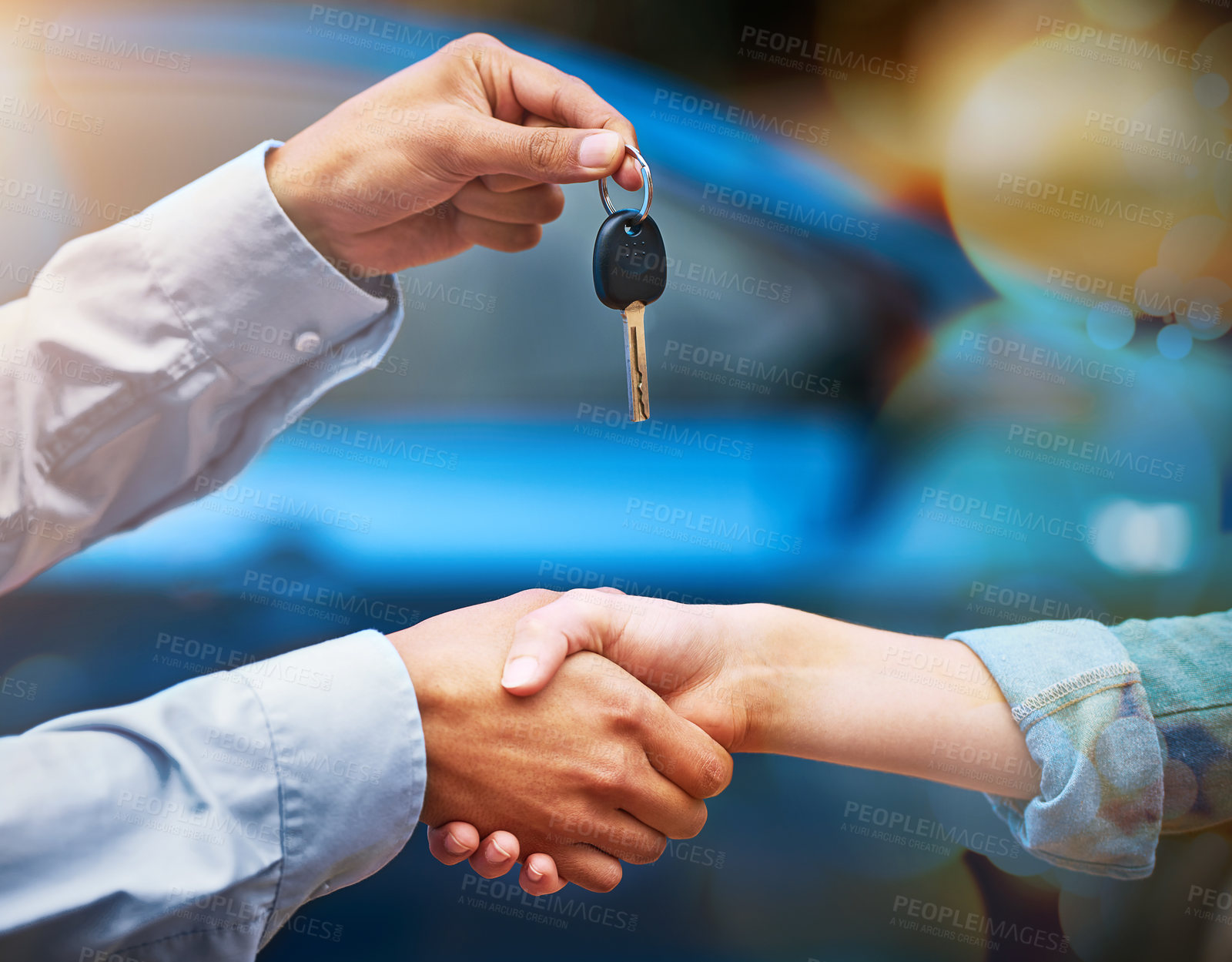Buy stock photo Cropped shot of a man handing a woman the keys to her new car