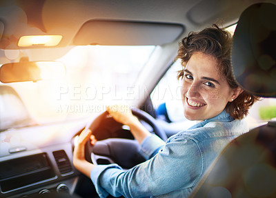 Buy stock photo Portrait of a happy young woman driving a car