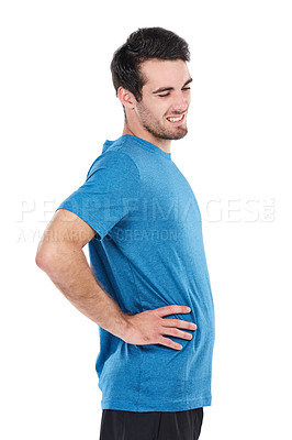 Buy stock photo Cropped shot of a young man holding his back in pain against a white background