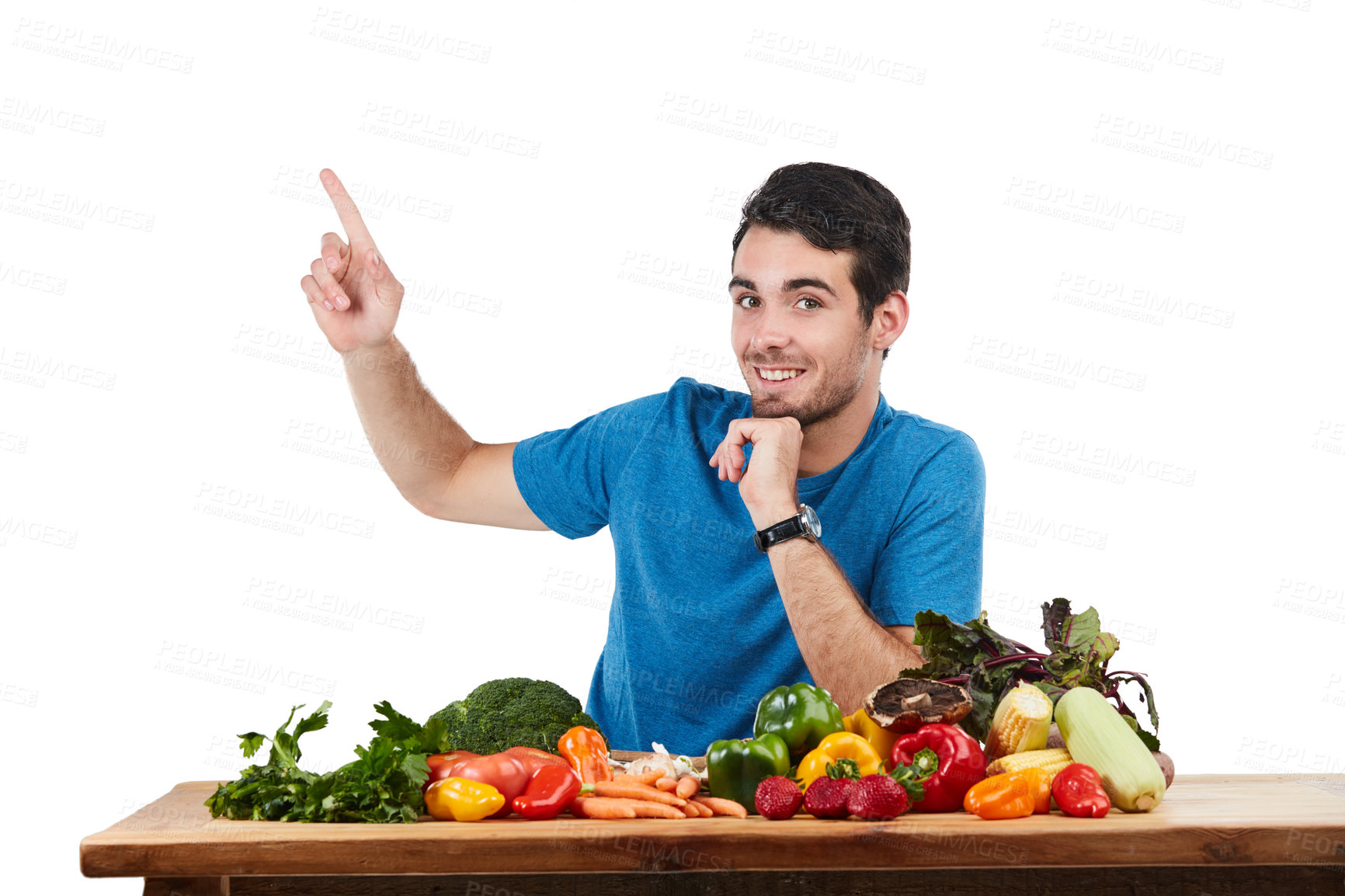 Buy stock photo Studio portrait of a handsome young man posing with a variety of fresh vegetables against a white background