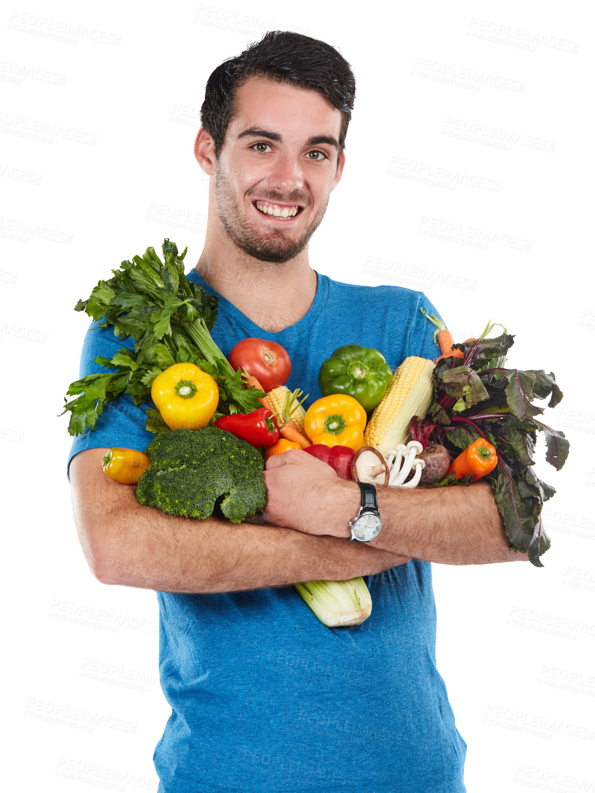 Buy stock photo Studio portrait of a handsome young man posing with a variety of fresh vegetables against a white background