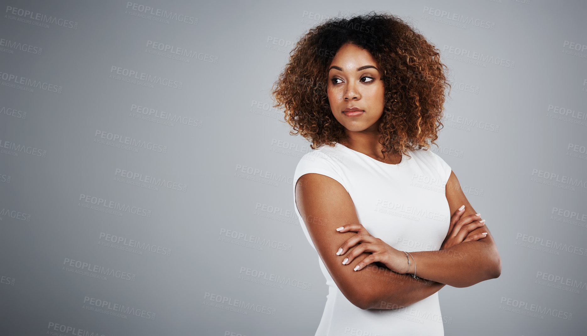 Buy stock photo Studio shot of a young businesswoman against a gray background