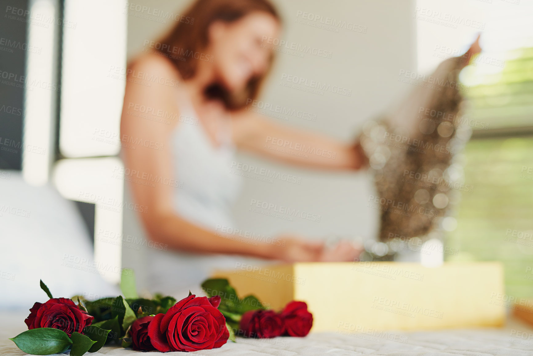 Buy stock photo Woman, roses and box with gift in bedroom on birthday, celebration and valentines day event in home. Girl, dress and fashion with bouquet, flowers and floral present with thinking on bed in house