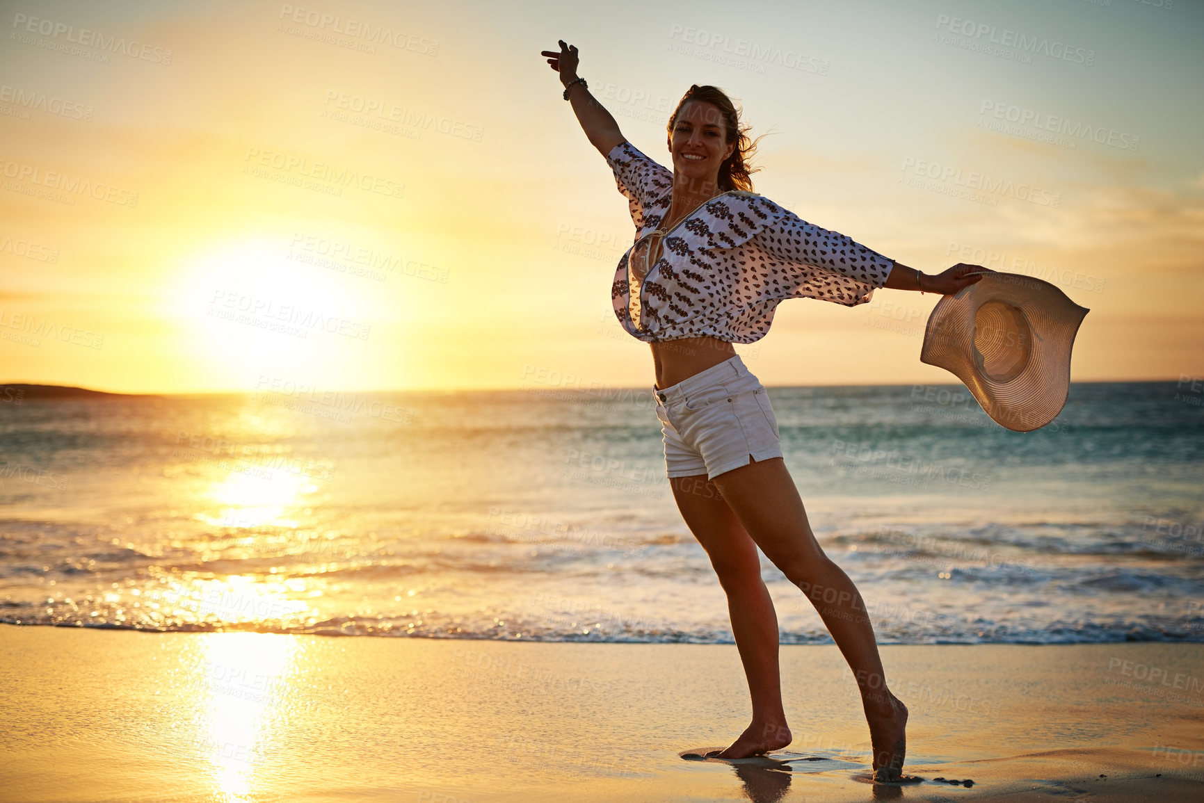 Buy stock photo Shot of a young woman on the beach