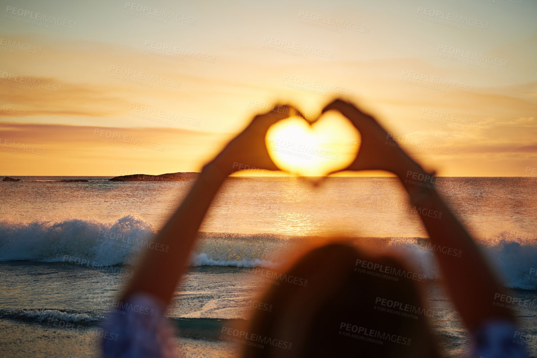 Buy stock photo Beach, heart and hands for sunset, love and travel peace, calm and ocean nature for outdoor wellness and summer. Woman, hand sign and emoji for sea, waves and holiday or vacation care on Miami coast