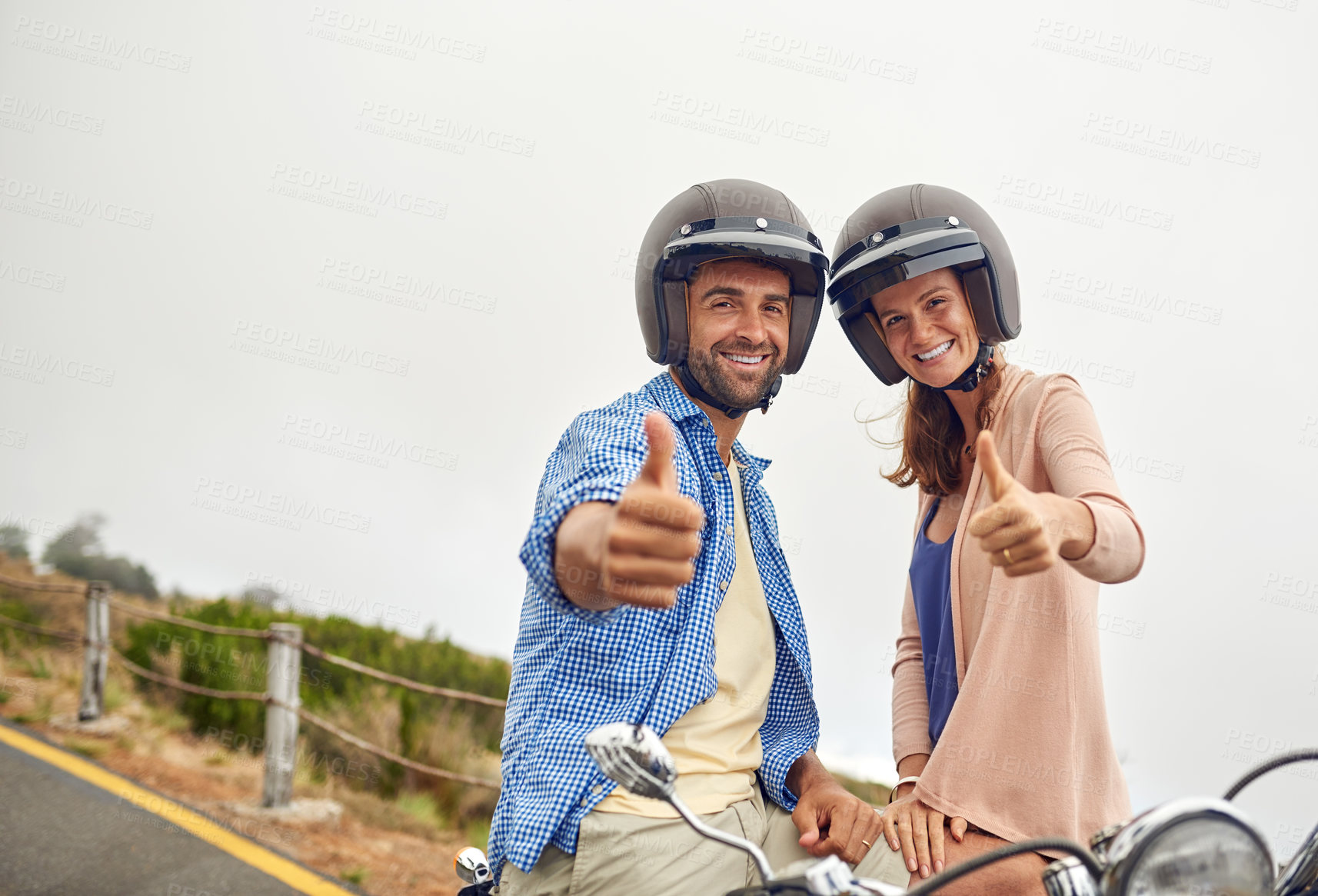 Buy stock photo Shot of an adventurous couple out for a ride on a motorbike