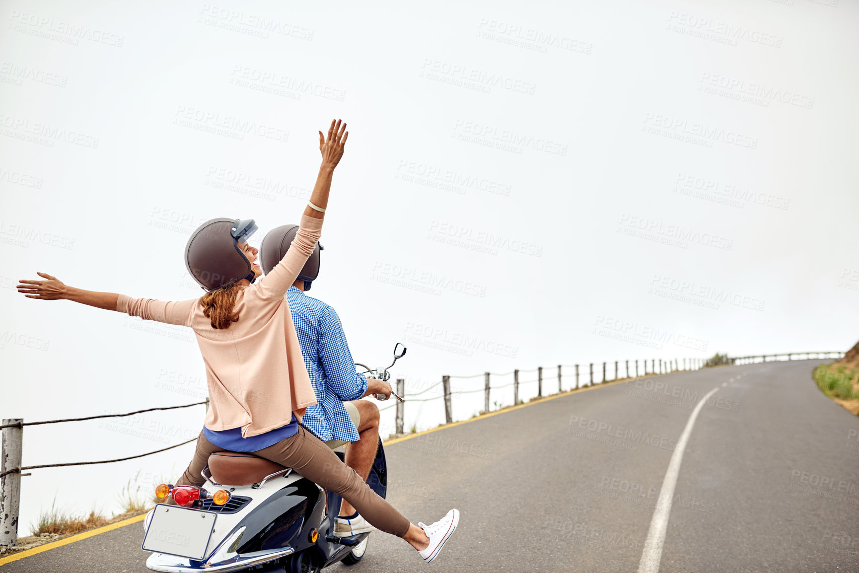 Buy stock photo Shot of an adventurous couple out for a ride on a motorbike