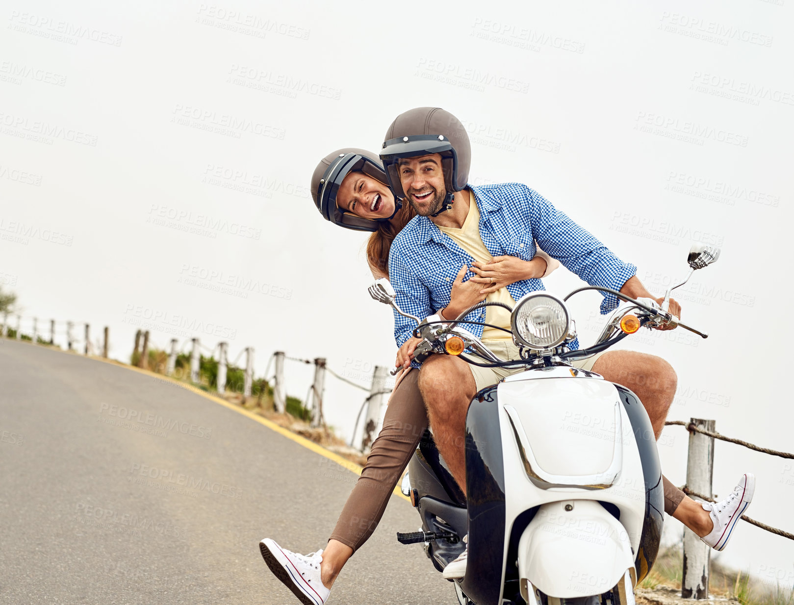 Buy stock photo Shot of an adventurous couple out for a ride on a motorbike