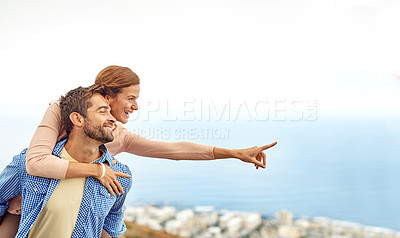 Buy stock photo Cropped shot of a man piggybacking his girlfriend while spending the day outdoors