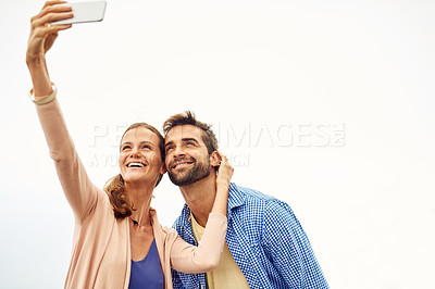 Buy stock photo Couple, phone and selfie on vacation, smile and outdoors on adventure, love and memories for social media. Happy people, smartphone and bonding or technology, travel and holiday or profile picture