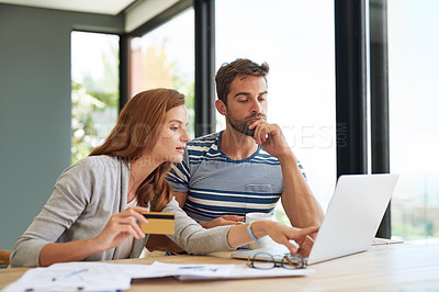 Buy stock photo Laptop, couple and credit card at table in morning for online shopping with purchase in house on weekend. Internet, banking and finance with bills, taxes and monthly payments for debt in apartment.