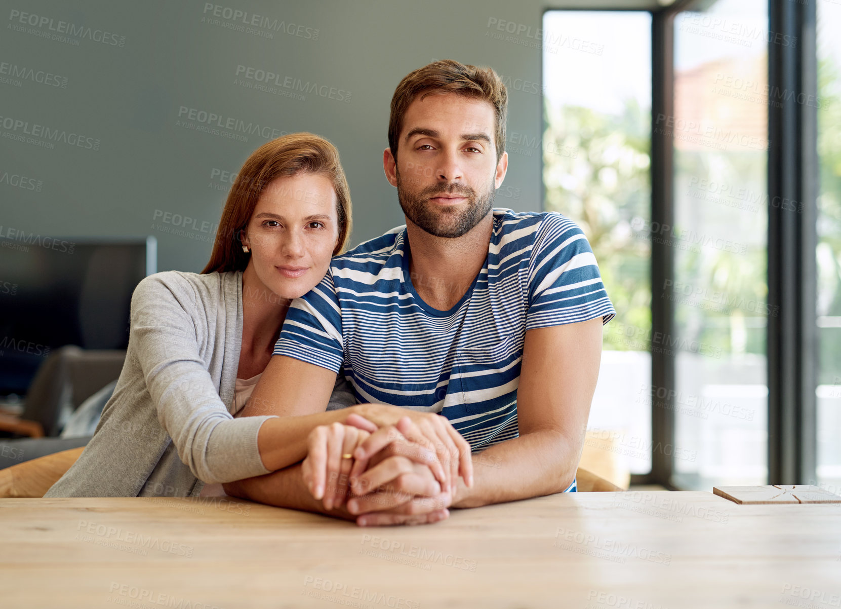 Buy stock photo Portrait, man and woman in home for love, marriage and together in morning or living room. Support, couple and holding hands for trust, care and connection or security for relationship in apartment