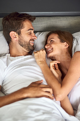 Buy stock photo Relax, couple and happy with hug on bed, wake up or peace for love marriage of commitment in morning house. Smile, woman and man with embrace for care, relationship romance or bonding together 
