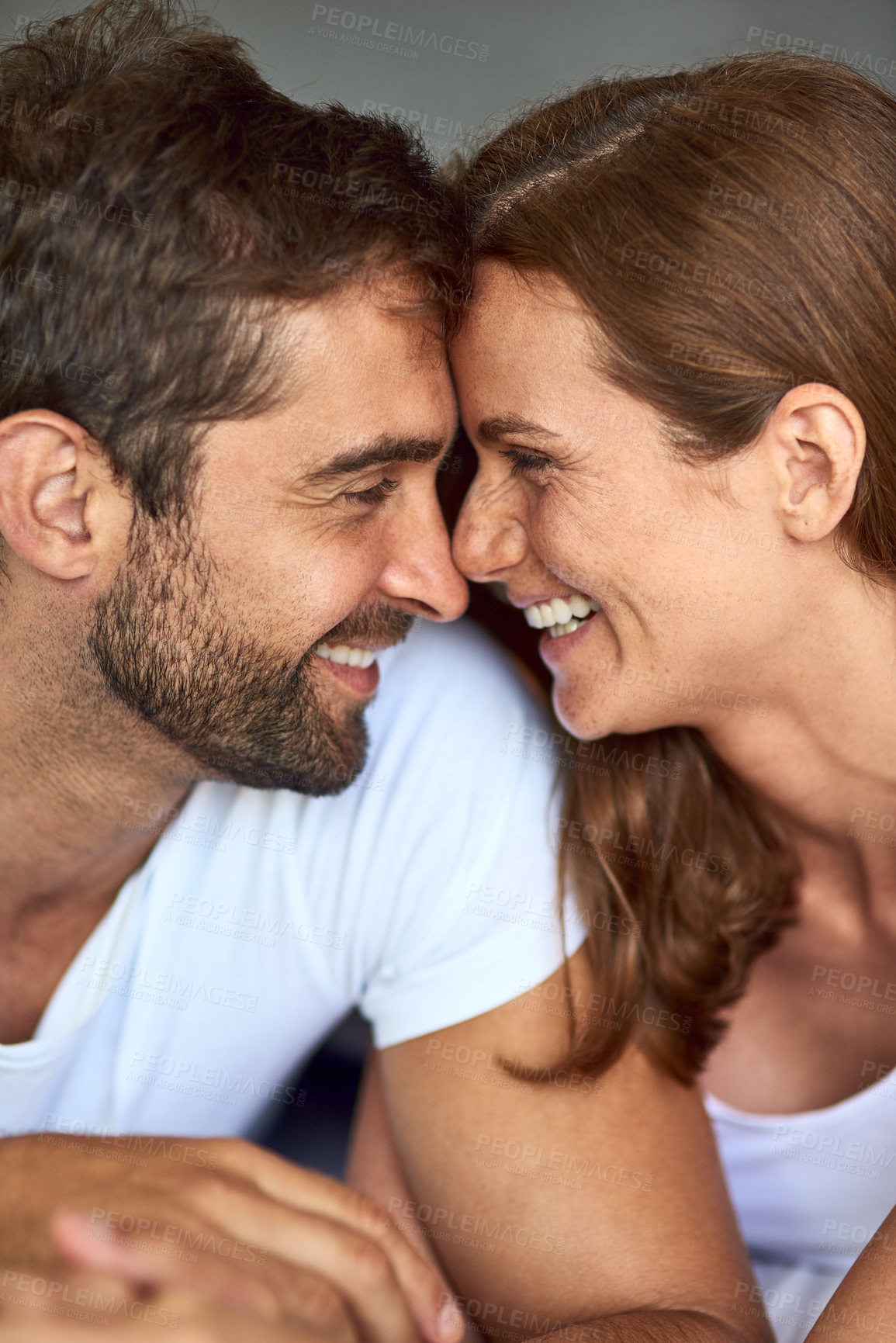 Buy stock photo Happy couple, love and laughing in morning, peace or support for marriage commitment at house. Wake up, bonding and funny people with smile for romantic relationship, loyalty and anniversary together