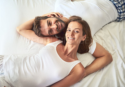 Buy stock photo Portrait, couple and relax on bed above view of bonding, peace or support for marriage commitment at house. Love, woman and man with embrace care, relationship romance or wake up together on holiday
