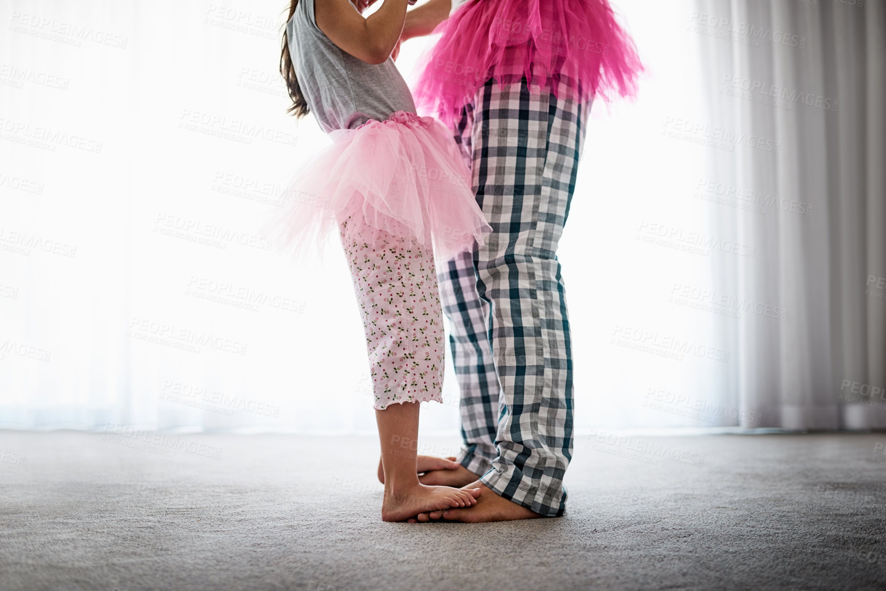 Buy stock photo Cropped shot of an unrecognizable father and his daughter dancing at home