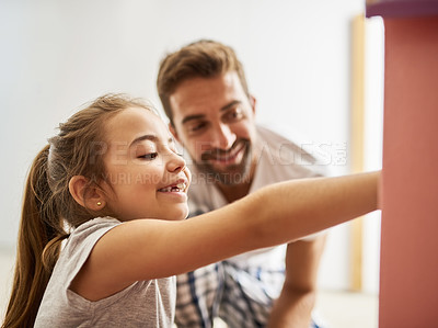 Buy stock photo Cropped shot of a handsome young man and his daughter playing with her dollhouse