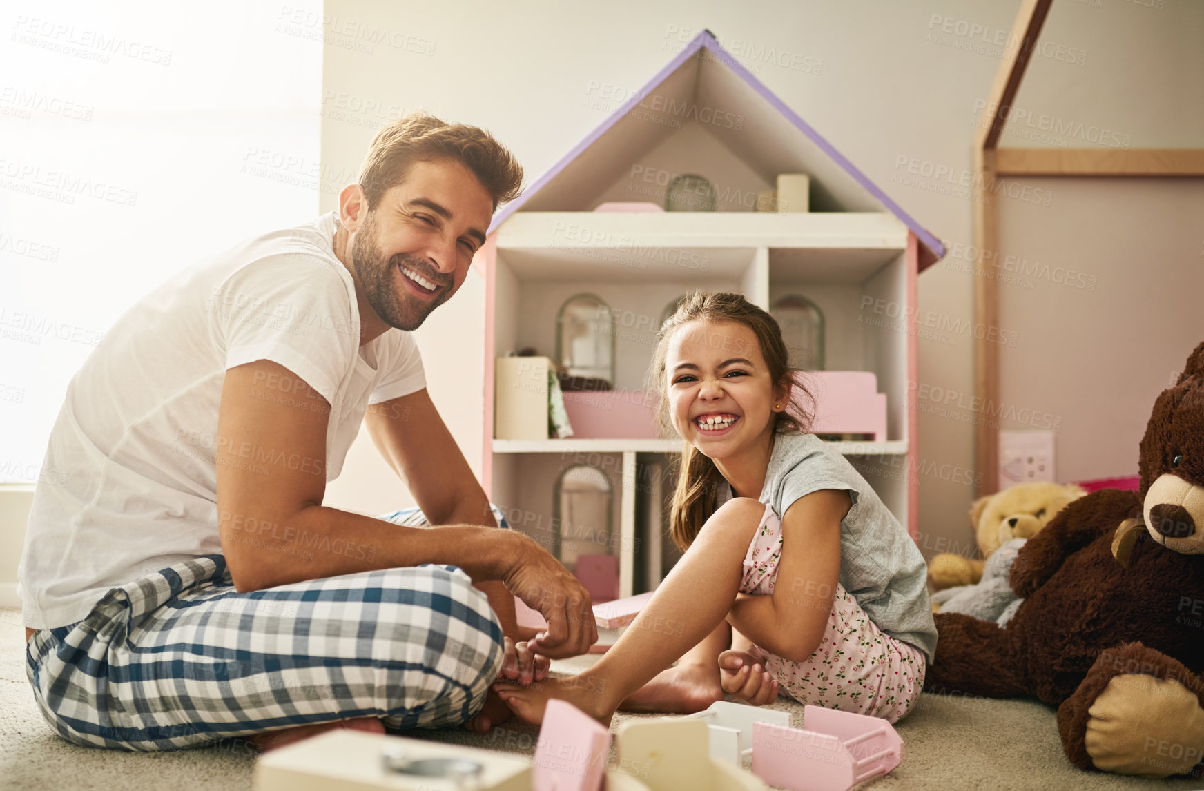 Buy stock photo Full length portrait of a handsome young man and his daughter playing with her dollhouse