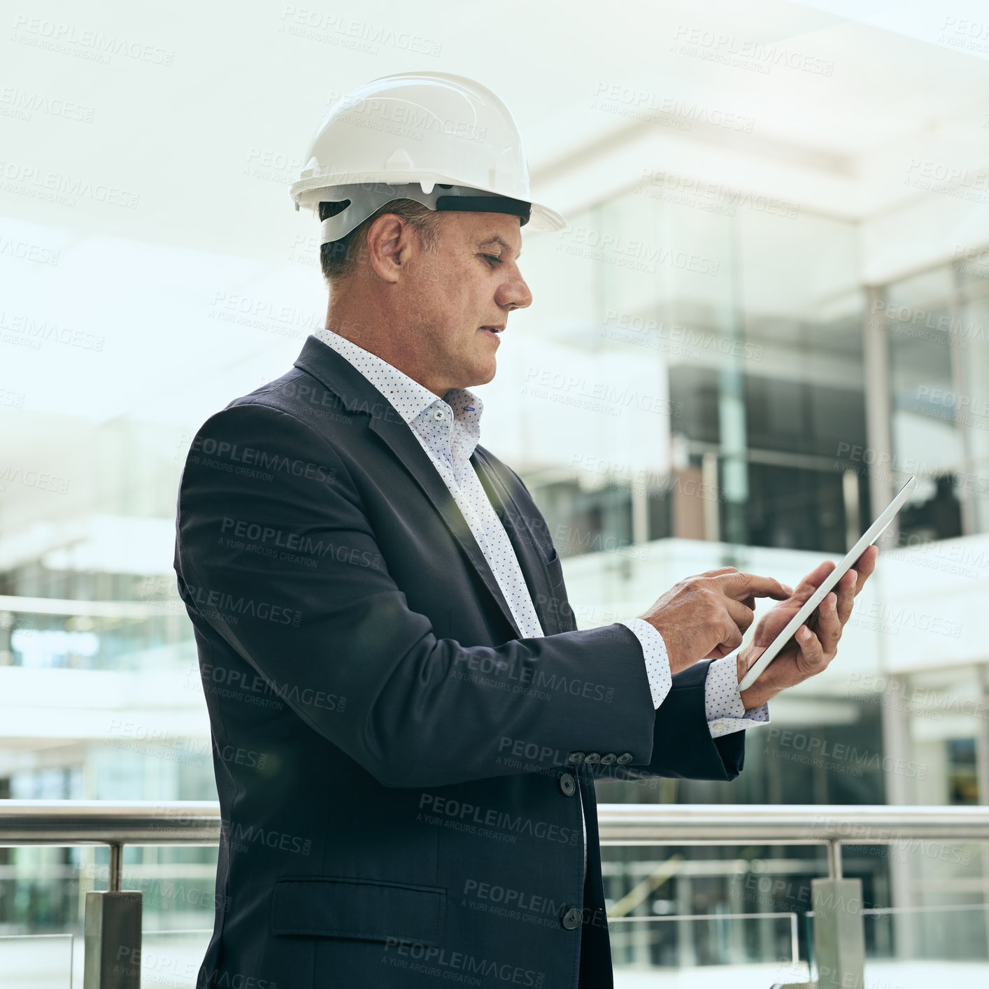 Buy stock photo Serious, tablet and mature man with helmet, construction and reading of update of plan for building. Balcony, architect and typing of businessman, online and thinking of architecture of property