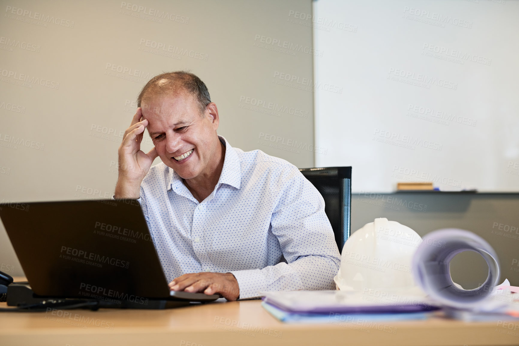 Buy stock photo Architect, happy and laptop in office with blueprint for building design, work and construction project. Business man, smile and tech in workplace with paperwork for planning, contractor and research