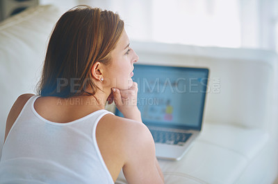 Buy stock photo Laptop, relax and thinking with woman on sofa in living room of home for online shopping or research. Computer, ecommerce and idea with serious person in apartment as customer for retail browsing