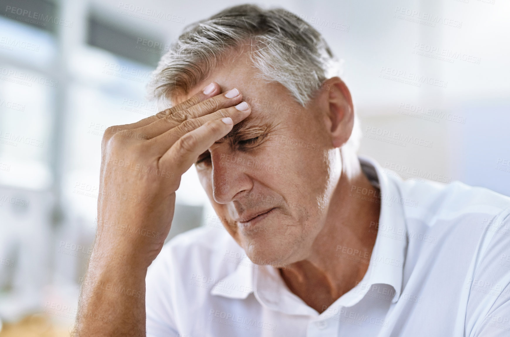 Buy stock photo Migraine, stress and senior businessman in the office with healthcare problem or medical emergency. Medical issue, burnout and sick professional corporate manager in pain with a headache in workplace