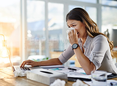 Buy stock photo Cropped shot of a businesswoman working in her office while suffering from allergies