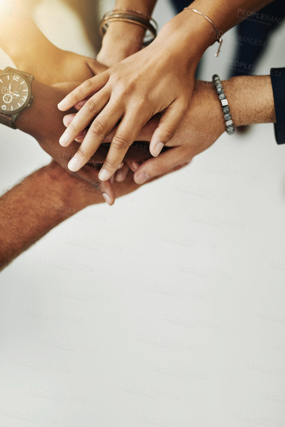 Buy stock photo Hands in a huddle for teamwork, unity and working together from above. Closeup of a diverse group or team collaborating, joining and connected as a united people, showing solidarity and cooperation