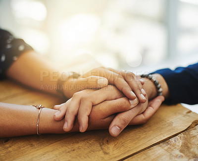 Buy stock photo Holding hands showing care, love and support between friends, couple or family. People comforting, giving affection and embracing friendship with a hand gesture and touch during a difficult time